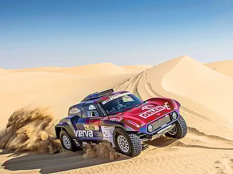 Jakub Przygonski steers his Mini John Cooper Works Buggy during the Dubai International Baja
