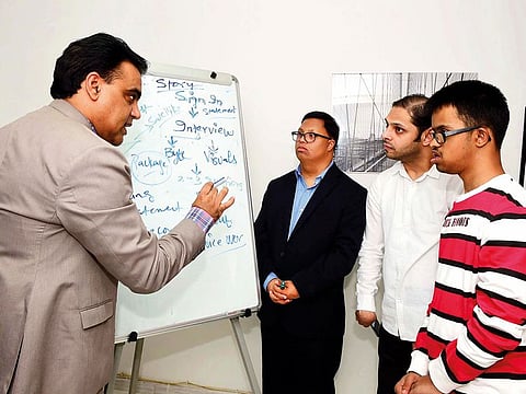 Dr Amit Kakkar with Christopher Swaminathan, Bilal Hafeez and Brendyn Monsorate during a training session at CMC Global Training Office in Deira ahead of the Special Olympics.