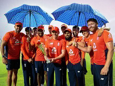 England players pose with the winning trophy.