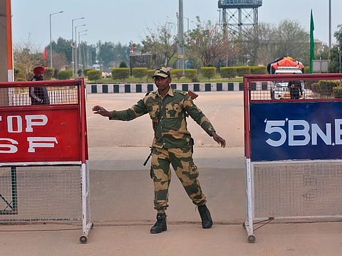 A Border Security Force soldier stands on the Indian side of the border, in Attari, India-Pakistan border, India.