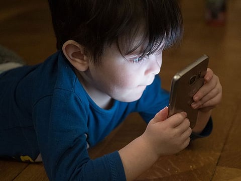 A boy using a smartphone