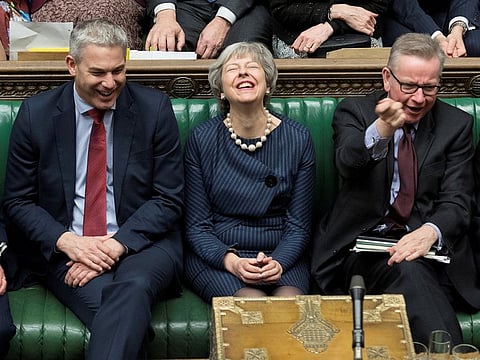 Britain's Prime Minister Theresa May reacts during the debate on extending Brexit negotiating period in Parliament in London, Britain, March 14, 2019.