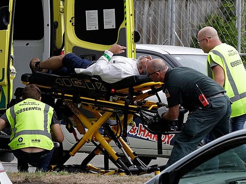 Ambulance staff take a man from outside a mosque in central Christchurch, New Zealand.