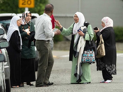 Members of a family react outside the mosque following a shooting at the Al Noor mosque in Christchurch, New Zealand, March 15, 2019.