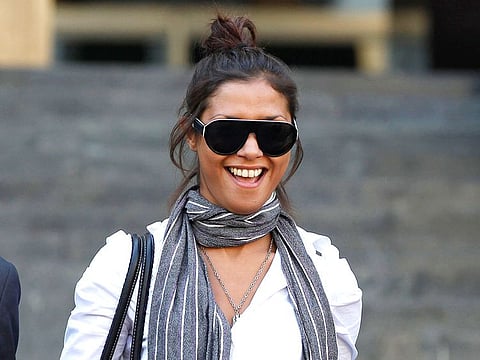 Imane Fadil smiles as she leaves the court in Milan, Italy. Italy prosecutors have opened an investigation into the death of a Moroccan model who testified in one of the inquiries linked to ex-Premier Silvio Berlusconi's "bunga bunga" parties.