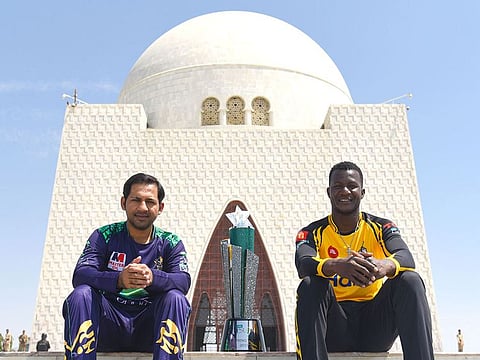 Quetta Gladiators skipper Sarfaraz Ahmad and Peshawar captain with the PSL trophy at the Quaid’s Mausoleum