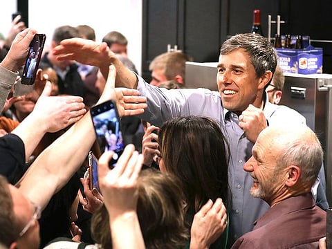 Democratic presidential candidate Beto O'Rourke shakes hands as he arrives at a packed St. Patrick's Day party at the home of County Recorder John Murphy in Dubuque, Iowa