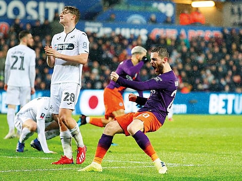 Manchester City’s Bernardo Silva celebrates scoring their first goal against Swansea City