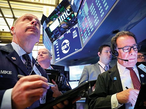 Traders at the New York Stock Exchange. The S&P500 index is 120 points away from its peak of 2,940.91.