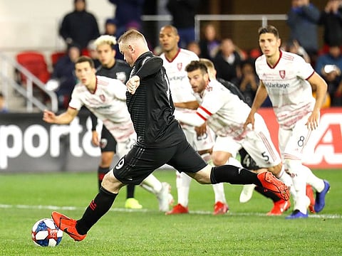 Wayne Rooney (9) scores a goal on a penalty kick against Real Salt Lake in the first half at Audi Field