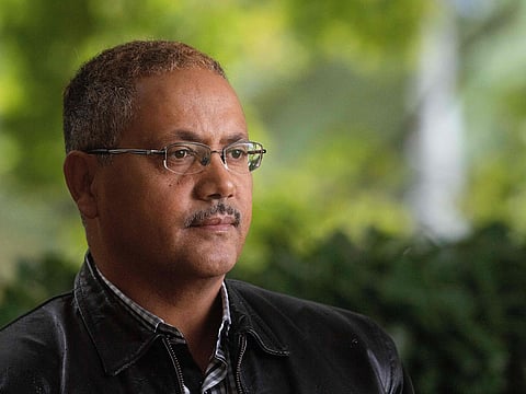 Abdul Kadir Ababora an Ethiopian living in New Zealand and who was in the Dean Street mosque when worshipers were gunned down on March 15, poses in Christchurch