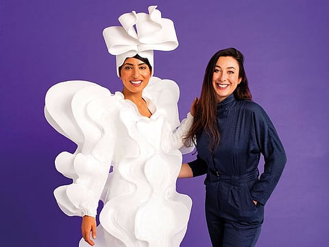 Designer Kate Tabor (right) with her coffee couture creation.