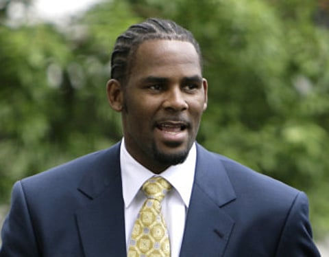 This June 13, 2008 file photo shows R&B singer R. Kelly arriving at 3the Cook County Criminal Court Building in Chicago.