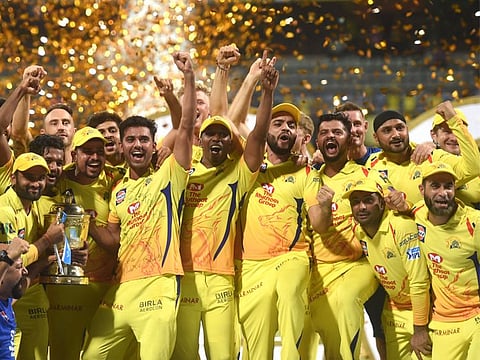 Chennai Super Kings players celebrate with the IPL 2018 trophy after winning the final match against Sunrisers Hyderabad, in Mumbai
