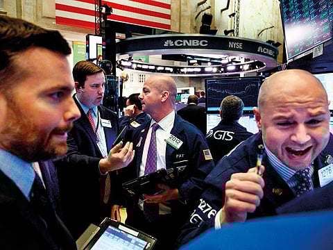 Traders at the New York Stock Exchange. All three major Wall Street futures gauges were pointing up again after bank and tech stocks helped extend a 20% charge in US markets this year.