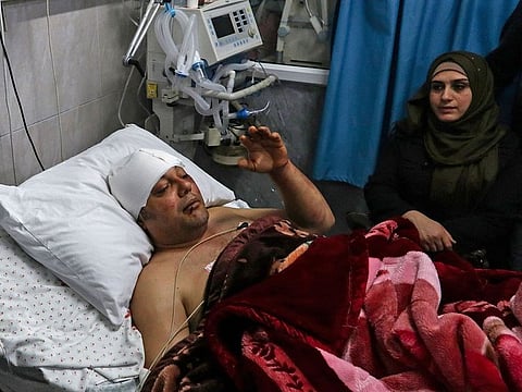 Atef Abu Seif, spokesman for Fatah in Gaza and a member of its central committee lies in a hospital bed in Gaza City on March 19, 2019. Abu Seif was badly beaten up in the Gaza Strip today, with Fatah accusing the strip's Islamist rulers Hamas of responsibility.