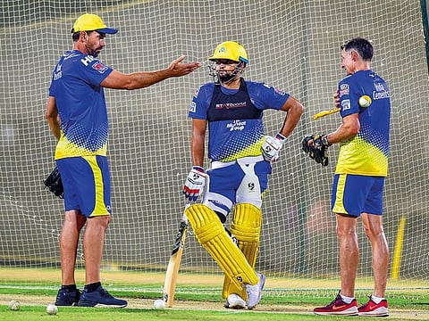 Michael Hussey (right) with Chennai Super Kings head coach Stephen Fleming (left) and batsman Suresh Raina during a practice session.