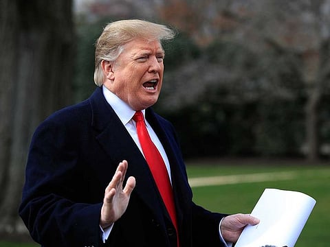 President Donald Trump speaks to reporters before leaving the White House in Washington, Wednesday, March 20, 2019, for a trip to visit a Army tank plant in Lima, Ohio, and a fundraising event in Canton, Ohio.