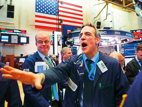 Traders at the New York Stock Exchange. As investors show growing concern about a slowing global economy, the Dow Jones Industrial Average fell over 450 points on Friday.