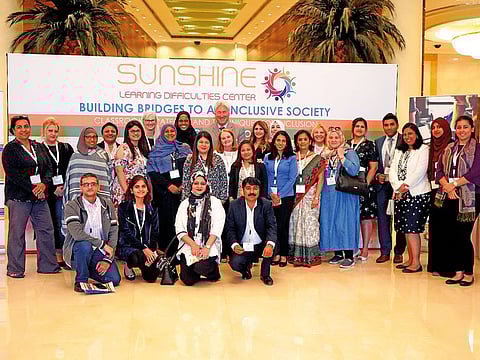 Marcheta Hightower (standing seventh from left) while attending the Building Bridges to an Inclusive Society conference organised by Sunshine Learning Difficulties Centre in Dubai recently