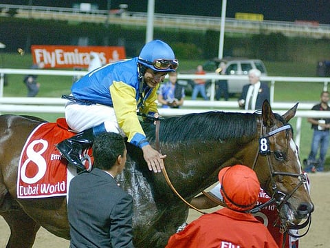 Jockey Alex Solis enjoys his moment of glory after guiding Pleasantly Perfect to Dubai World Cup.