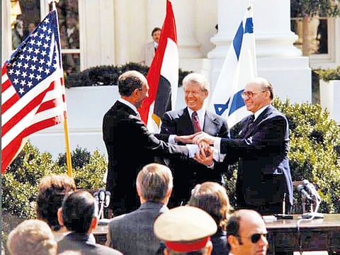US President Jimmy Carter, Egyptian President Anwar Sadat and Israeli Prime Minister Menachem Begin at the signing of the peace treaty in Washington on March 26, 1979.