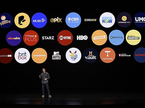 File picture of Peter Stern, vice-president of services at Apple Inc., against an app backdrop.