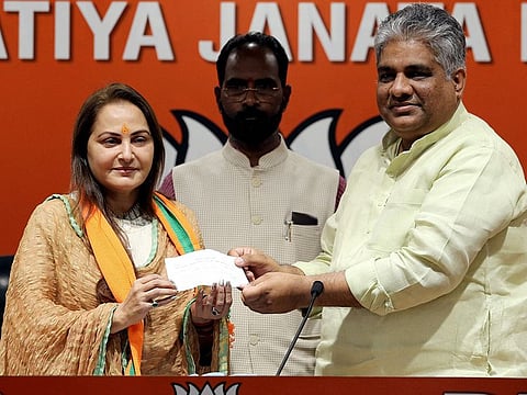 Bharatiya Janata Party General Secretary Bhupender Yadav presents the membership slip to veteran actor and former MP Jaya Prada as she joins BJP, in New Delhi.