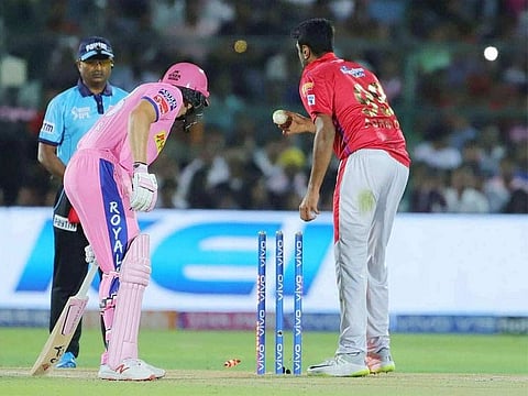 Kings XI Punjab skipper R Ashwin, right, and Rajasthan Royals batsman Jos Buttler during the incident.