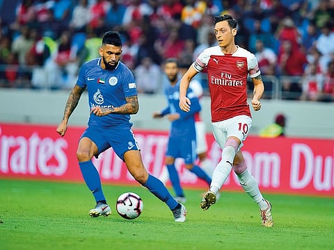 Ronnie Fernandez scores a goal for Al Nasr against Arsenal during the friendly at the Al Maktoum Stadium in Dubai on Tuesday. The Gunners won the clash 3-2.