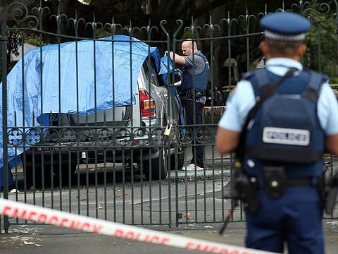 Police investigate a vehicle at the scene where a man died of stab wounds in Christchurch on March 27, 2019.