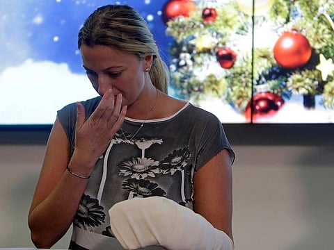 Czech Republic's tennis player Petra Kvitova reacts during a news conference after she was injured when she fought off an intruder in her home, damaging all the fingers on her playing hand, in Prague, Czech Republic December 23, 2016