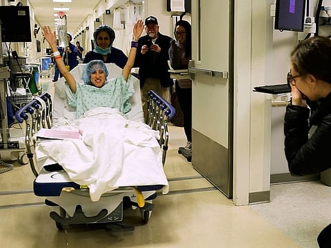 In this image made from video provided by Johns Hopkins Medicine, Nina Martinez of Atlanta is wheeled into a Baltimore operating room to become who is thought to be the world’s first kidney transplant living donor with HIV, on Monday, March 25, 2019.