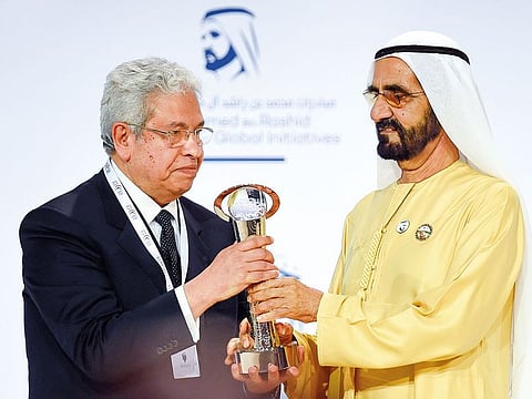 Shaikh Mohammad honours Dr. Abdul Moneim Saeed, winner of the ‘Best Columnist Award’ at the Arab Journalism Awards.