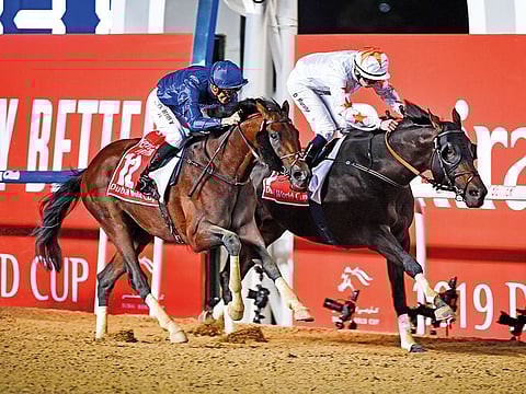 Thunder Snow, ridden by Christophe Soumillon (left), on way to winning the million Dubai World Cup in 2018.