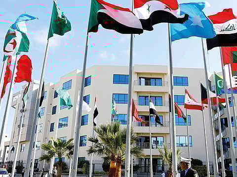 Flags flutter outside the venue of a preparatory meeting between Arab foreign ministers in Tunis on Friday.