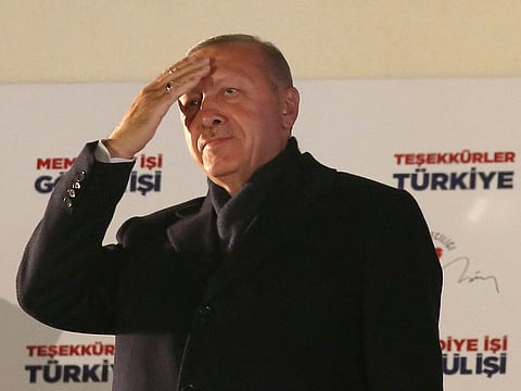 Turkey's President and ruling Justice and Development Party, or AKP, leader Recep Tayyip Erdogan greets supporters after the results of the local elections were announced in Ankara, Turkey, early Monday, April 1, 2019.