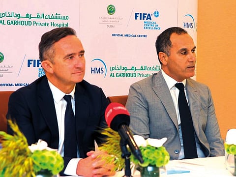 Dr Philippe Landreau (left) being introduced by Dr Mourad Ghairi as the latest addition to the Fifa Medical Centre of Excellence team.