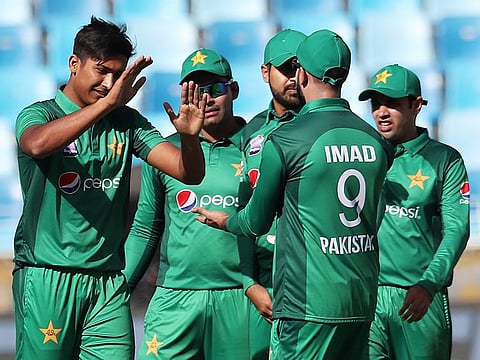 Mohammad Hasnain (left) celebrates the dismissal of Australia's Aaron Finch during the fourth ODI match held at Dubai International Stadium on March 29, 2019.