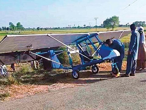 Mohammad Fayaz, who dreamed of becoming an air force pilot, with his homemade plane in Pakpattan, Punjab.