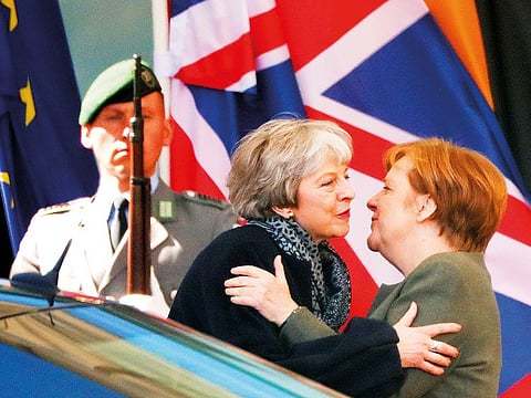 German Chancellor Angela Merkel kisses British Prime Minister Theresa May as she leaves after they met to discuss Brexit, at the chancellery in Berlin, Germany, April 9, 2019.