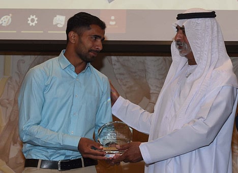 Shaikh Nahayan Bin Mubarak Al Nahayan, Minister of Tolerance, handing over the Most Aspiring Employee of the Year Award to Mohammad Haseebur Rehman.