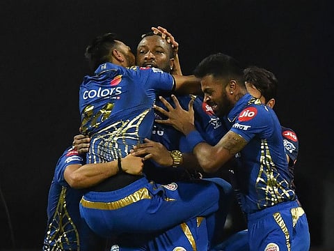 Mumbai Indians cricketers in jubilation after clinching a thrilling victory in the IPL 2019 final.