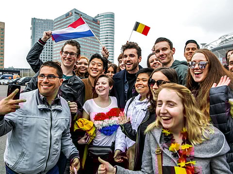 The Netherlands' singer Duncan Laurence (centre) poses with fans as he arrives to meet other 2019 Eurovision participants for a concert press day, a taste of the Eurovision Song Contest, in Amsterdam.