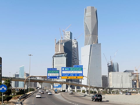 File photo: Cars drive past the King Abdullah Financial District in Riyadh