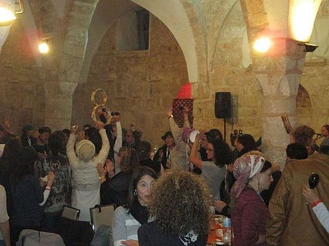 Israelis dance inside the mosque-turned-bar