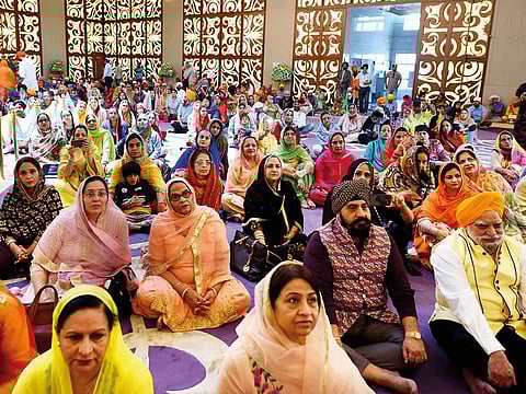 Devotees during the Baisakhi celebration at Guru Nanak Darbar on Sunday.