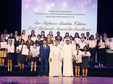 Shaikh Nahayan Bin Mabarak Al Nahayan, Minister of Tolerance, GEMS Education Chairman Sunny Varkey and Dr. Omar Bin Sulaiman, Chairman OBS Group, with the winners of Shaikha Fatima Bint Mubarak Awards for Excellence.