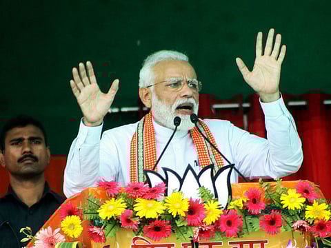 Indian Prime Minister Narendra Modi gestures while speaking at an election rally during the first phase of the Indian general elections in Bhagalpur, in the Indian state of Bihar on April 11, 2019.