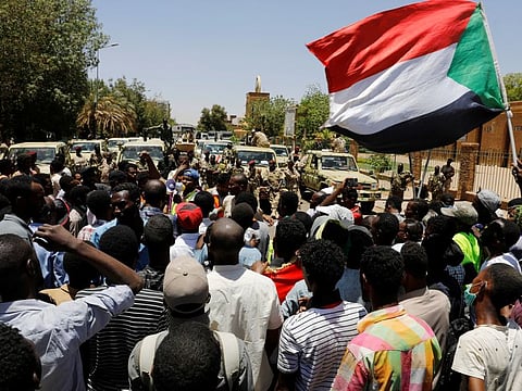 Sudanese demonstrators chant slogans in front of security forces during a protest in Khartoum, Sudan April 15, 2019. REUTERS/Umit Bektas
